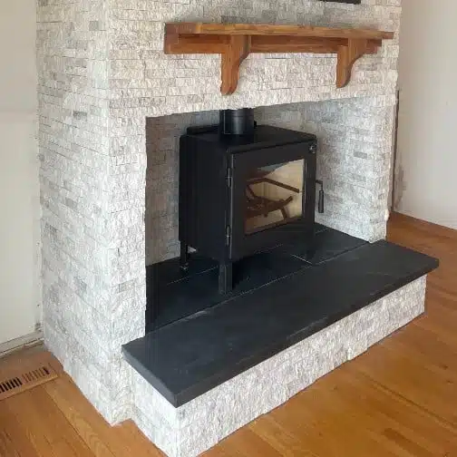 Refacing of a wood burning fireplace with stone finish